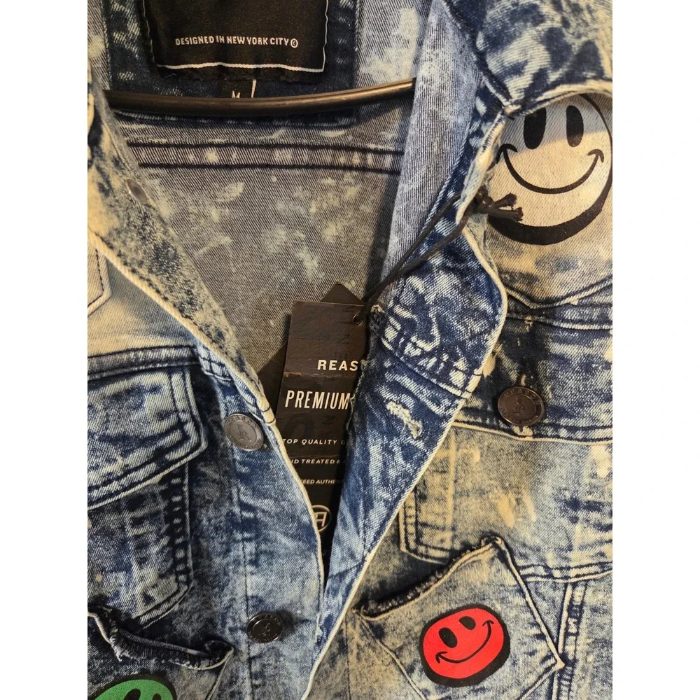NEW WITH TAGS  Reason Clothing Smiley Face Multi-Pocket Distressed Denim Jacket